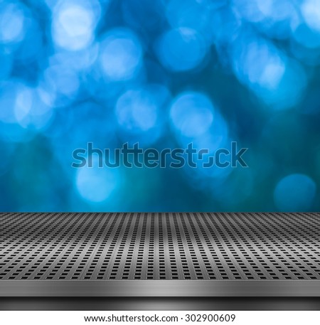 Blurred lights bokeh background with empty metal deck table ready for product display montage. Metal texture concepts