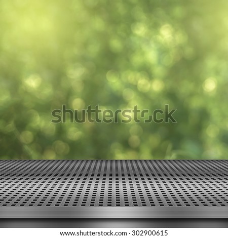 Shiny sunlight bokeh background with empty metal deck table ready for product display montage.