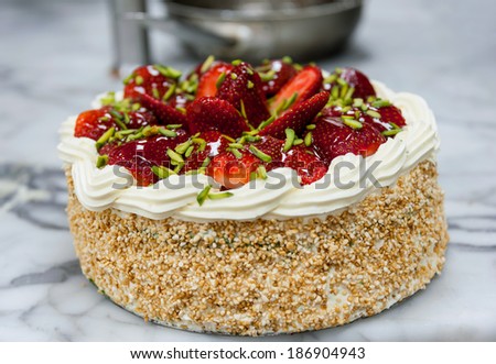 Strawberry cream cake with nuts