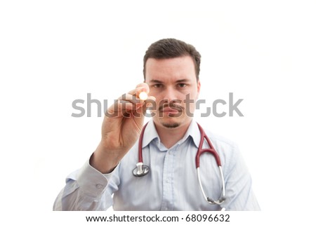 Doctor checks pupils with torch. Depth of field effect with doctor out of focus