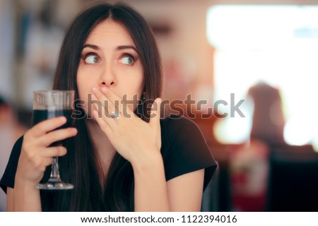 Funny Girl Reacting after Drinking Frizzy Soda Drink. Woman covering her moth after drinking cola