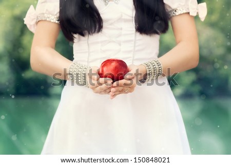 Snow White princess with the famous red apple Snow White princess with the famous red apple