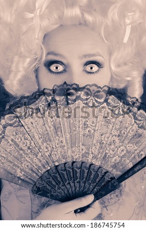 Surprised  Baroque Woman Monochrome Portrait with Wig and Fan - Baroque style portrait of a surprised beautiful woman behind a hand fan