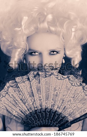 Beautiful Baroque Woman Monochrome Portrait with Wig and Fan - Baroque style portrait of a young beautiful woman behind a hand fan