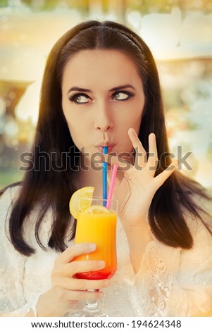 Young Woman with Colorful Cocktail Drink Outside - Beautiful woman enjoying a cocktail drink on a sunny day