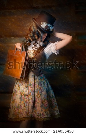 Steampunk Girl with Leather Portfolio Bag - Portrait of a young woman wearing a steampunk outfit and holding a portfolio bag
