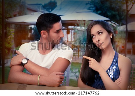 Cute Young Couple Arguing - Young adult couple arguing with funny expressions and gestures, out on a date
