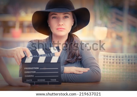 Elegant Diva Ready for a Shoot - Young woman wearing a broad hat is ready to film a new scene
