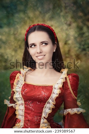 Beautiful Medieval Princess Smiling - Portrait of a happy beautiful Renaissance queen in red royal dress