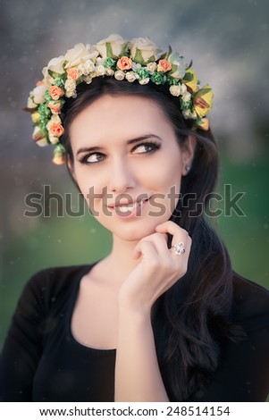 Portrait of a Happy Girl with Floral Wreath Outside - Close-up of a beautiful young woman outside wearing a floral headdress
