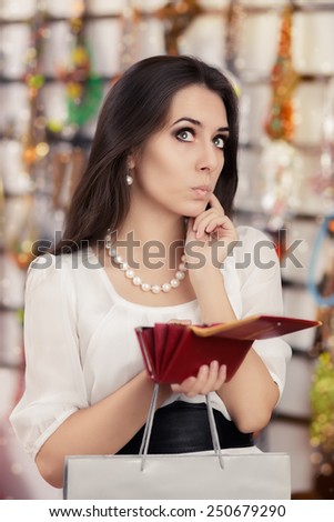 Cute Broke Woman at  Shopping Checking Wallet - Portrait of a funny girl looking for money in her purse