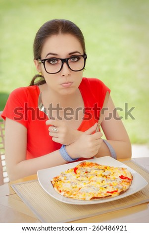 Hungry Woman with Hands Tied with Measure Tape - Beautiful girl on diet trying to eat a pizza