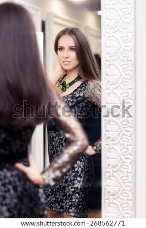 Beautiful Girl in Black Lace Dress Looking in the Mirror - Portrait of a young woman in a dressing room with an evening gown and a statement necklace