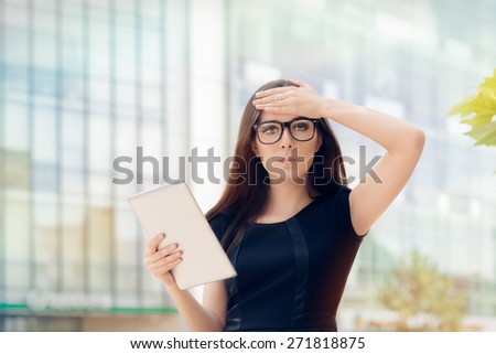 Young Woman with Tablet Having an Idea- Woman wearing glasses, eyeglasses holding a PC tablet having a revelation