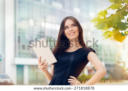 Young Woman with Tablet Out in the City - Woman holding a PC tablet thinking about a strategy