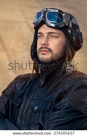Retro Pilot Portrait with Glasses and Vintage Helmet - Image of a handsome and confident aviator man