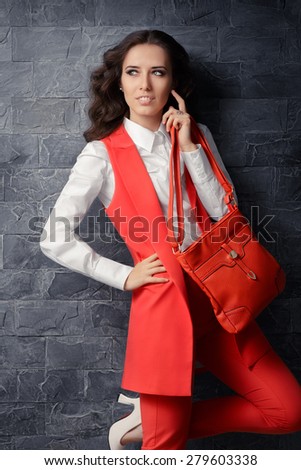 Business Woman in Smart Office Outfit with Matching Handbag - Image of a trendy and stylish business woman
