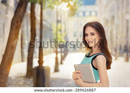 Woman with Pc Tablet Out in the City - Portrait of a businesswoman holding a tablet