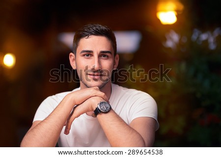 Young Man Sitting in a Restaurant - Portrait of a man wearing a watch waiting for his date