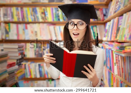 Surprised School Student Reading a Book in a Library - Portrait of a school graduate woman with graduation cap and big glasses