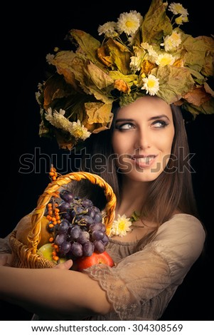 Beautiful Woman with Autumn Fruits Gift Basket - Portrait of a autumnal fairy girl with leaves wreath