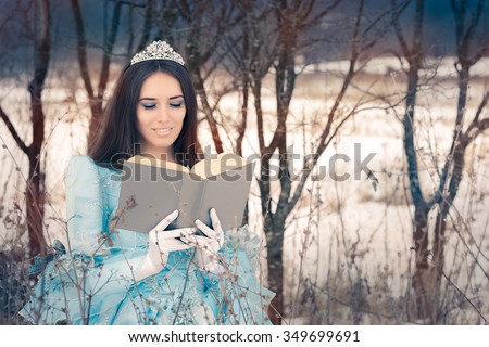 Beautiful Snow Queen Reading a Book - Portrait of a happy beautiful queen in royal dress reading a story book
