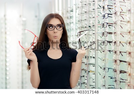 Woman Choosing Eyeglasses Frames in Optical Store - Cute girl deciding for glasses of different shapes and colors