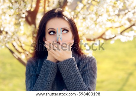Funny Girl Trying Desperate Measures to Fight Spring Allergies - Cute spring woman protecting her nose from allergens