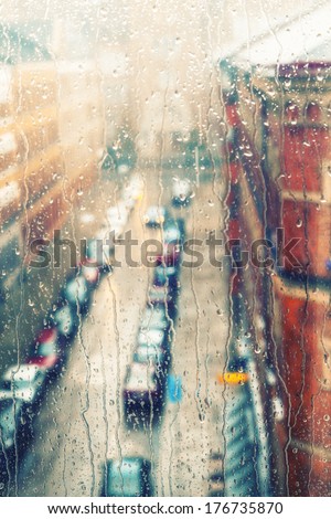 Rainy days,Rain drops on window with street view ,rainy weather,rain background