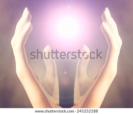Hands of woman  praying  to the light