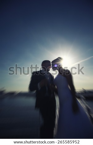 Silhouette couple over sunset ,heart bokeh background ,emotions and love concept,happiness
