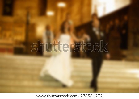 wedding couple walking into church for ceremony ,blurred wedding and love background