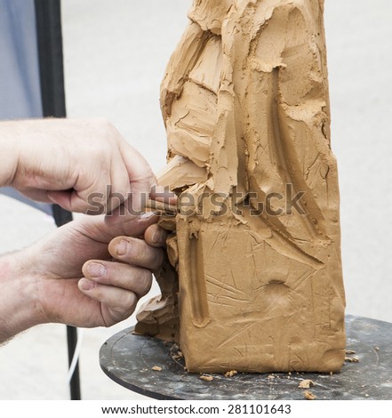 sculptor making sculpture,hand making ,