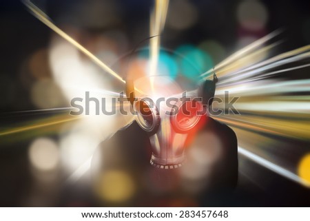man with a gas mask in neon colors and colorful bokeh ,disco and party night unusual,