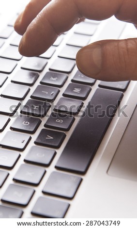 hand typing on the laptop ,office space ,office background