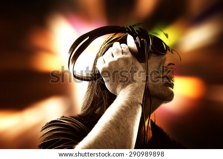 man holding headphones,dj with headphones ,dj party background