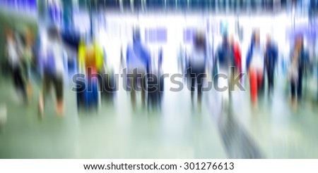 people walking in metro station,  blurred motion,travelers on train station,vacation time ,rush hour