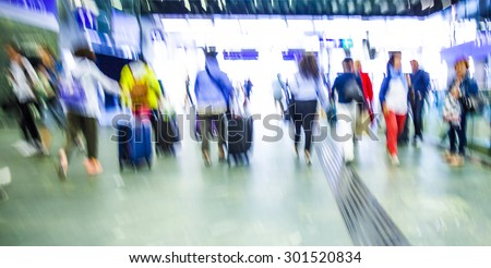 people walking in metro station, blurred motion,travelers on train station,vacation time,rush hour