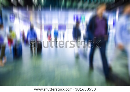 people walking in metro station, blurred motion,travelers on train station,vacation time,rush hour