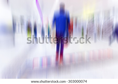 blurry people walking in metro station on rush hour ,