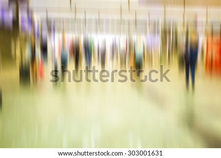 people walking in metro station on rush hour,blurred background