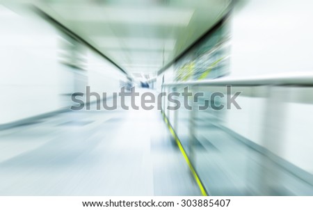 blurry people walking in metro station on rush hour
