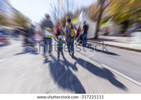 modern family walking in the city ,blurred  urban family  background