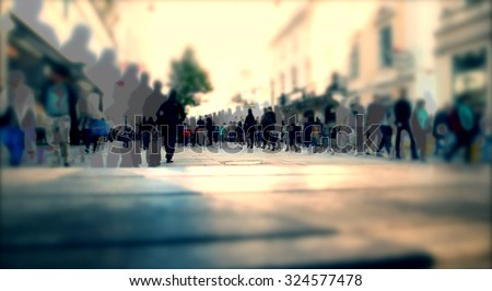 Silhouette of people walking on the street of big city shopping day, big crowd of people walking