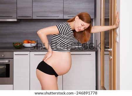 Beauty pregnant woman suffering lower back pain
