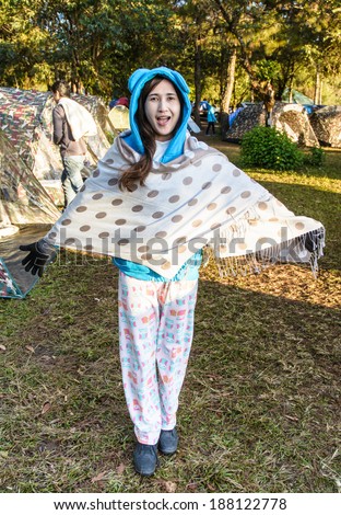 portrait asia young girl wear winter clothes so happy at outdoor camping and nature background