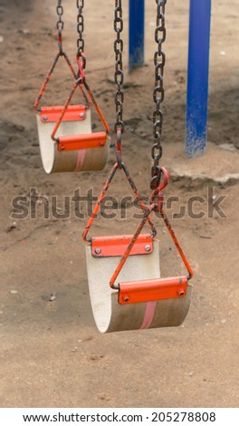 swing for kid on sand play yard park at outdoor summer