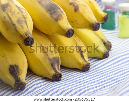 fruit yellow Bunch of ripe bananas on fabric textile background