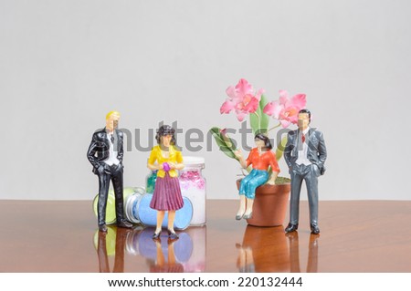 miniature family people with flower deco concept two family business