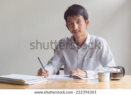 business man working  with paper sheet at work table
